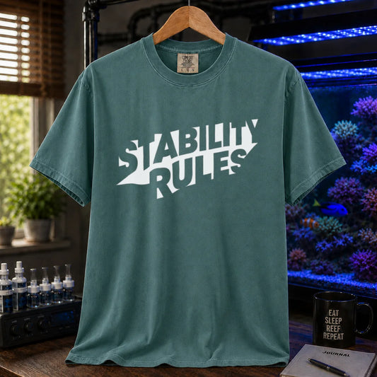 Saltwater aquarium graphic t-shirt featuring bold slanted block text reading STABILITY RULES, green crew neck tee
