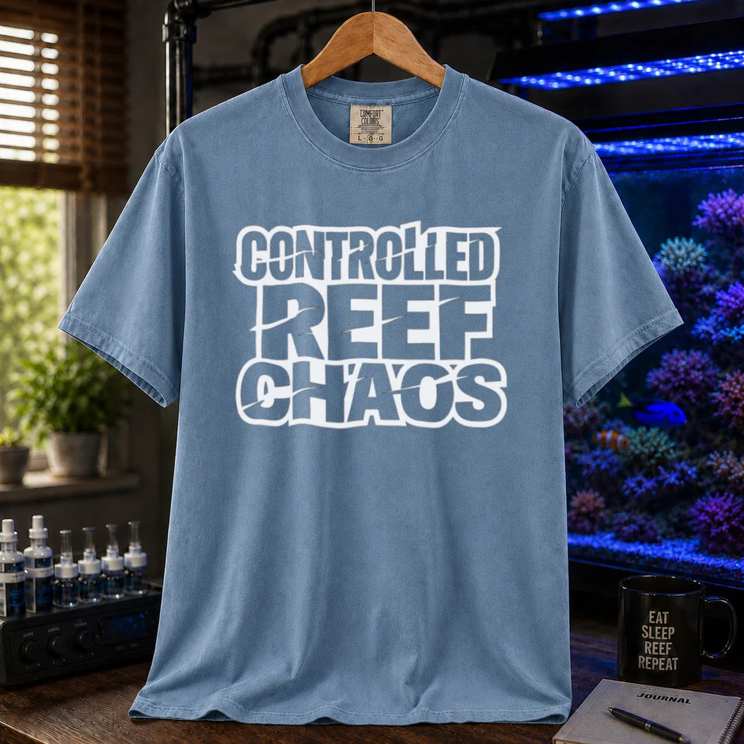 Saltwater aquarium graphic t-shirt featuring bold distressed block text reading CONTROLLED REEF CHAOS, blue crew neck tee