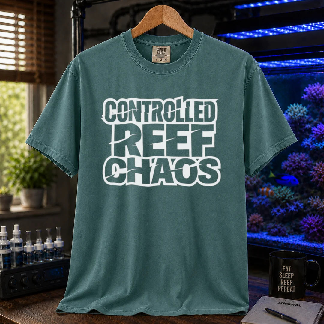 Saltwater aquarium graphic t-shirt featuring bold distressed block text reading CONTROLLED REEF CHAOS, green crew neck tee