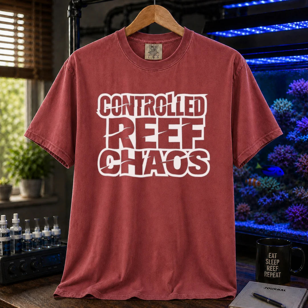 Saltwater aquarium graphic t-shirt featuring bold distressed block text reading CONTROLLED REEF CHAOS, maroon, red crew neck tee