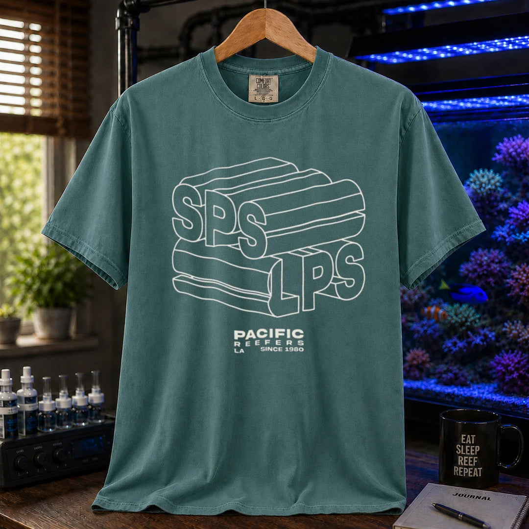 Saltwater aquarium graphic t-shirt featuring 3D extruded typography reading SPS and LPS above PACIFIC REEFERS LA SINCE 1980, green crew neck tee