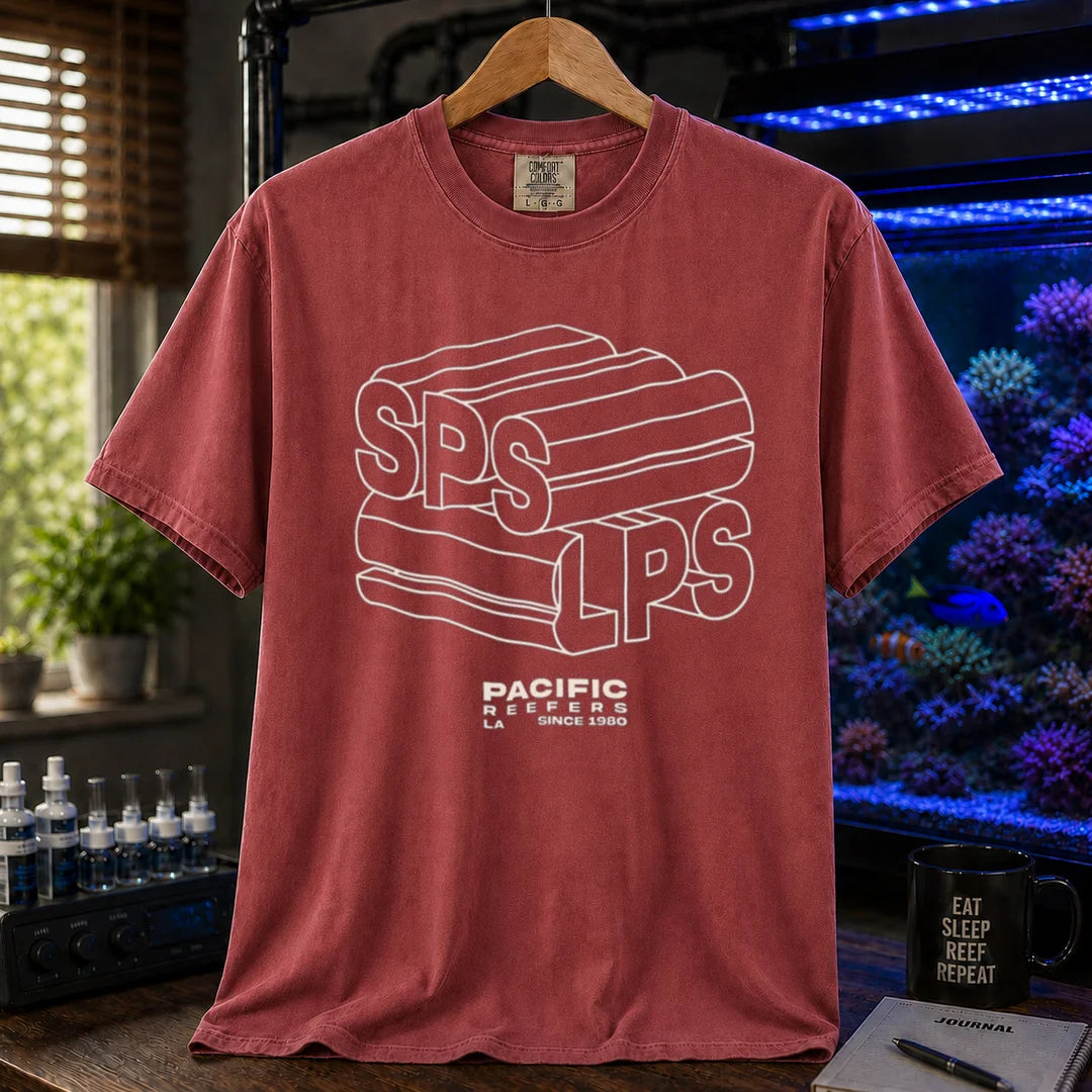 Saltwater aquarium graphic t-shirt featuring 3D extruded typography reading SPS and LPS above PACIFIC REEFERS LA SINCE 1980, maroon, red crew neck tee