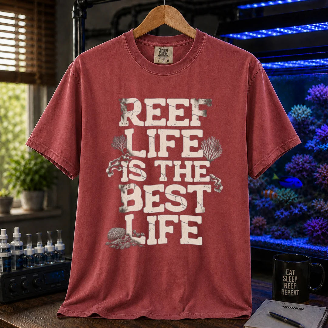 Saltwater aquarium graphic t-shirt featuring distressed white block text reading REEF LIFE IS THE BEST LIFE framed with coral illustrations, maroon, red crew neck tee