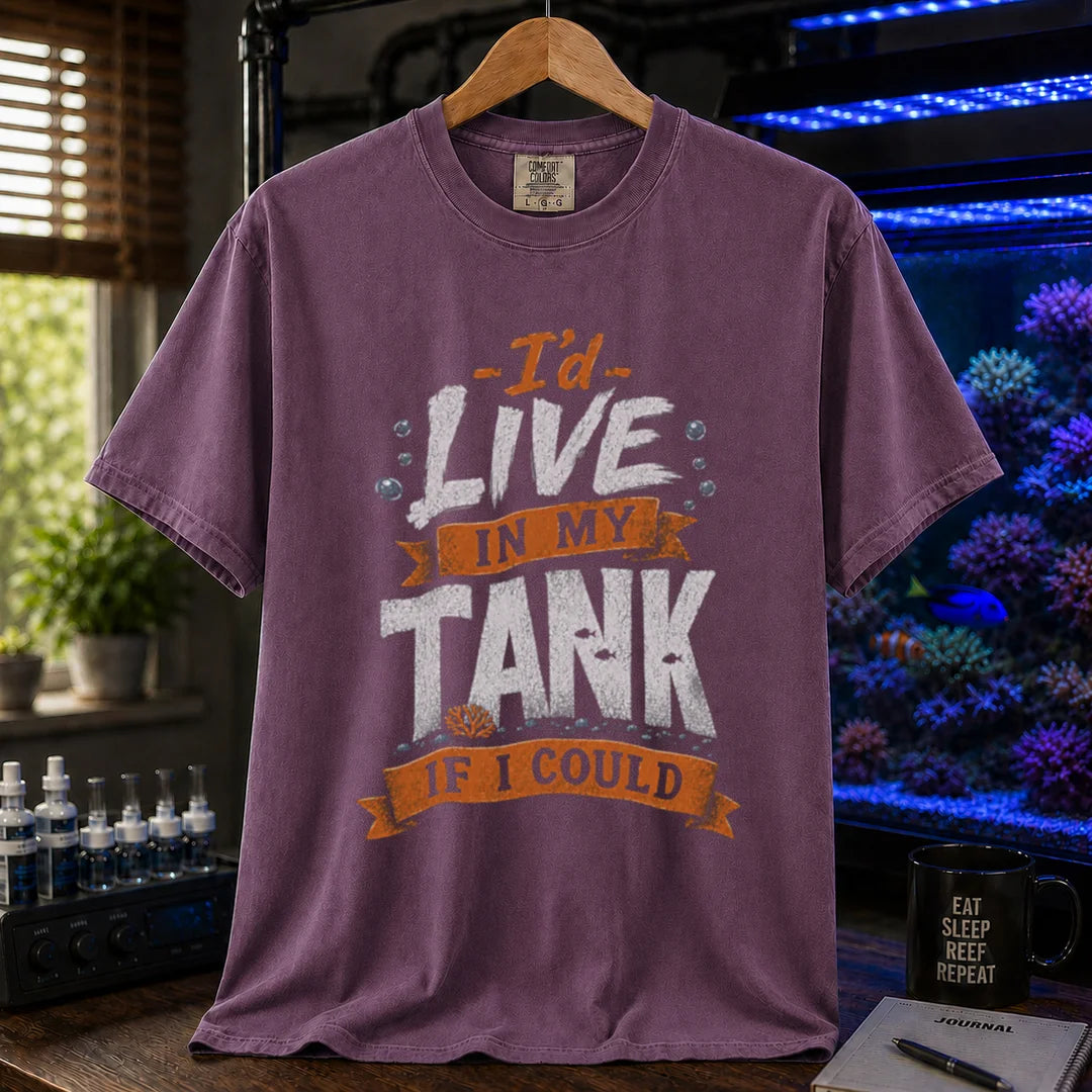Saltwater aquarium graphic t-shirt featuring orange and white typography reading I'd Live In My Tank If I Could with bubbles and fish accents, purple crew neck tee