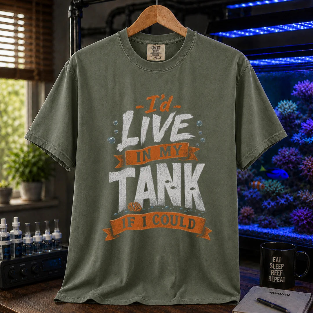 Saltwater aquarium graphic t-shirt featuring orange and white typography reading I'd Live In My Tank If I Could with bubbles and fish accents, military green crew neck tee
