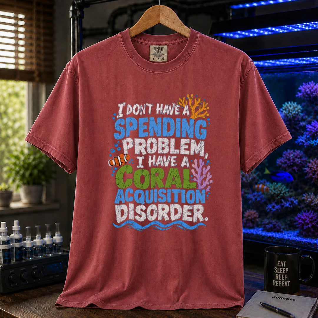 Saltwater aquarium graphic t-shirt featuring colorful distressed text reading I Don't Have A Spending Problem, I Have A Coral Acquisition Disorder with a clownfish and coral accents, maroon, red crew neck tee