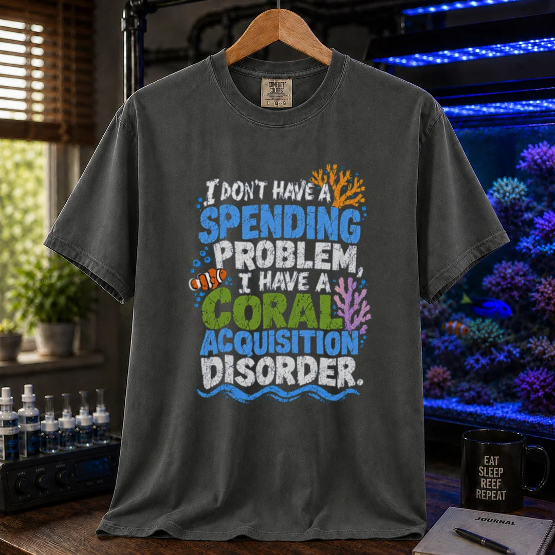 Saltwater aquarium graphic t-shirt featuring colorful distressed text reading I Don't Have A Spending Problem, I Have A Coral Acquisition Disorder with a clownfish and coral accents, dark grey crew neck tee