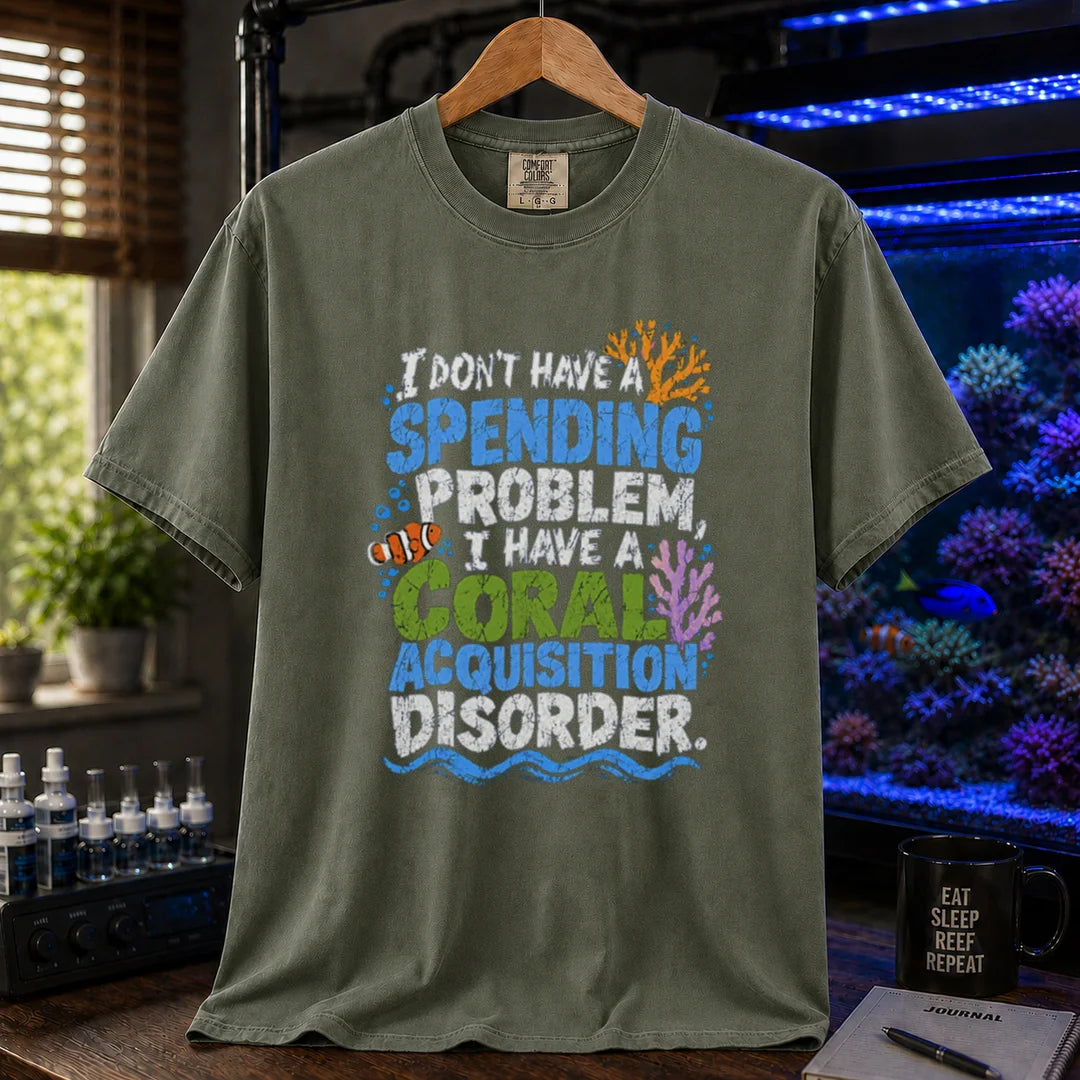 Saltwater aquarium graphic t-shirt featuring colorful distressed text reading I Don't Have A Spending Problem, I Have A Coral Acquisition Disorder with a clownfish and coral accents, military green crew neck tee