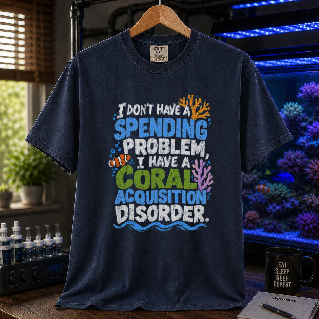 Saltwater aquarium graphic t-shirt featuring colorful distressed text reading I Don't Have A Spending Problem, I Have A Coral Acquisition Disorder with a clownfish and coral accents, navy crew neck tee