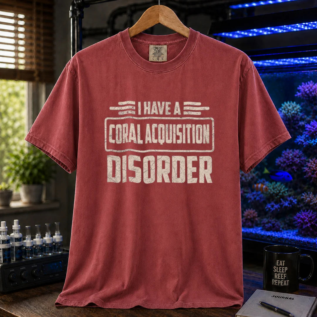 Saltwater aquarium graphic t-shirt featuring distressed cream typography reading I Have A Coral Acquisition Disorder inside a retro box frame, maroon, red crew neck tee