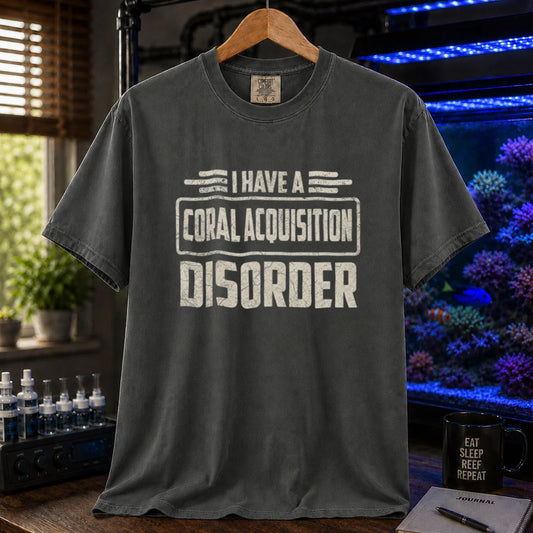 Saltwater aquarium graphic t-shirt featuring distressed cream typography reading I Have A Coral Acquisition Disorder inside a retro box frame, dark grey crew neck tee