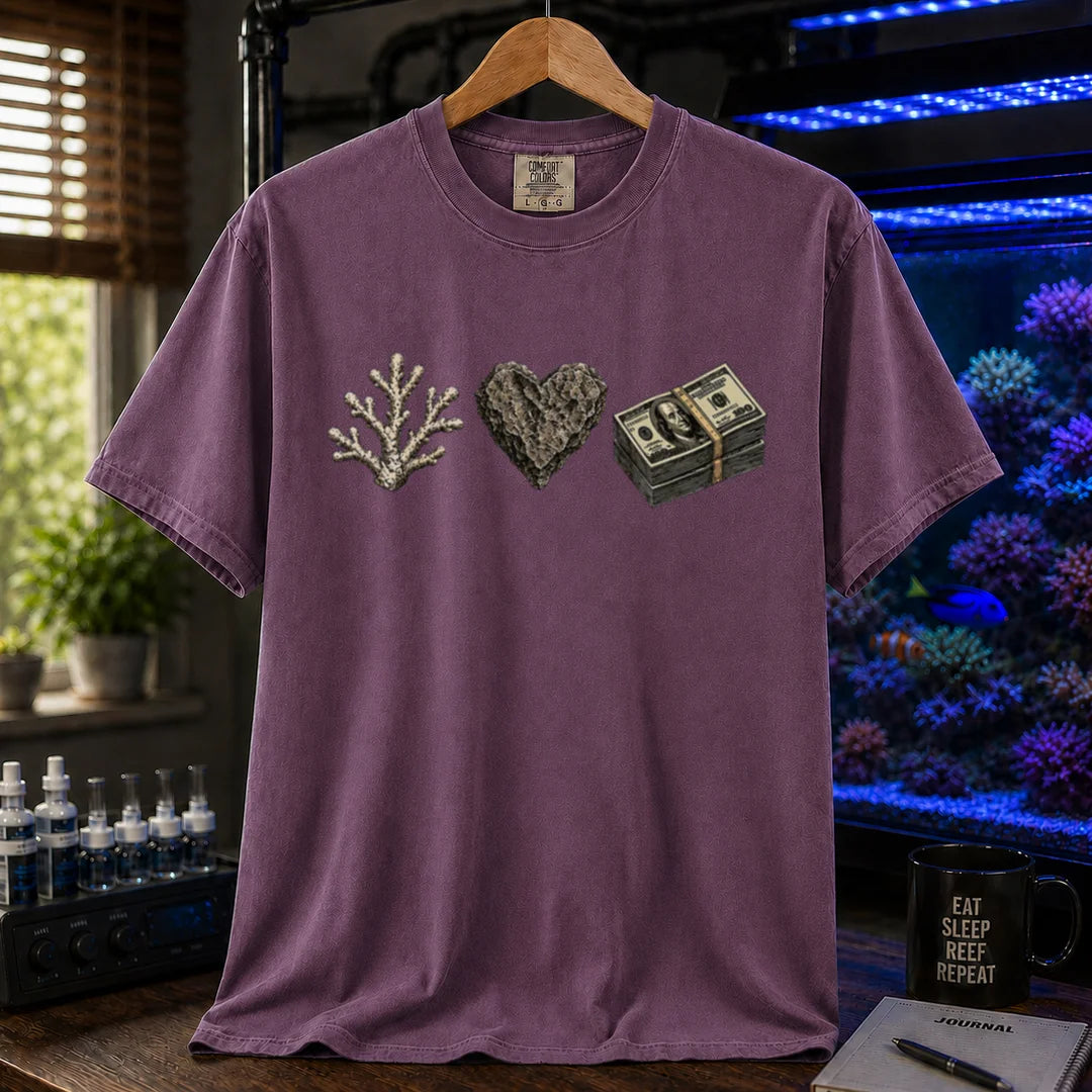Saltwater aquarium graphic t-shirt featuring line art of a coral branch, a heart-shaped rock, and a stack of hundred dollar bills, purple crew neck tee