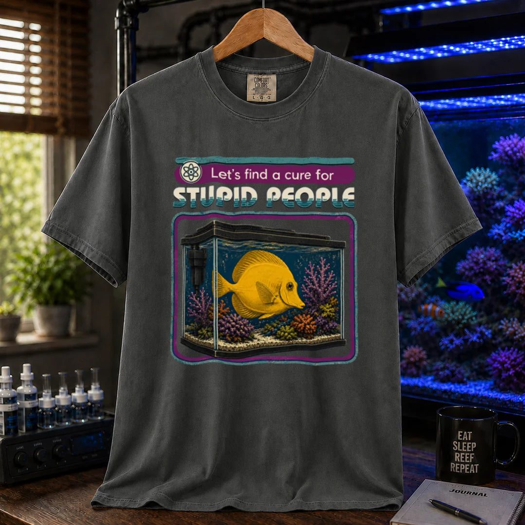 Saltwater aquarium graphic t-shirt featuring retro text reading Let's Find A Cure For Stupid People above an illustration of a yellow tang in a reef tank, dark grey crew neck tee