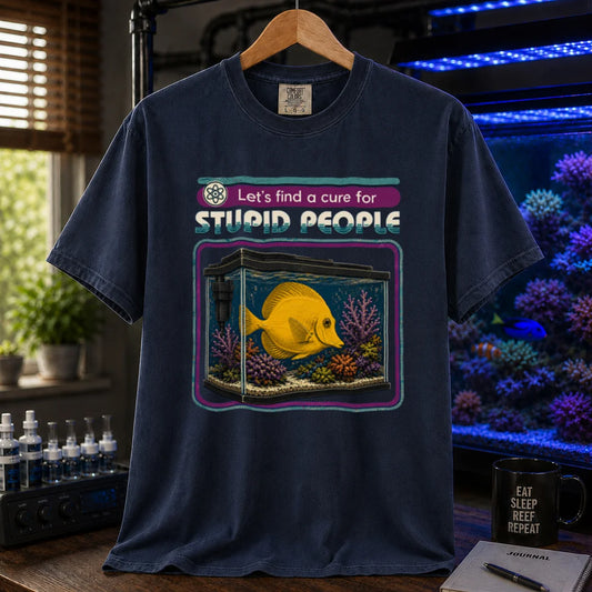 Saltwater aquarium graphic t-shirt featuring retro text reading Let's Find A Cure For Stupid People above an illustration of a yellow tang in a reef tank, navy crew neck tee