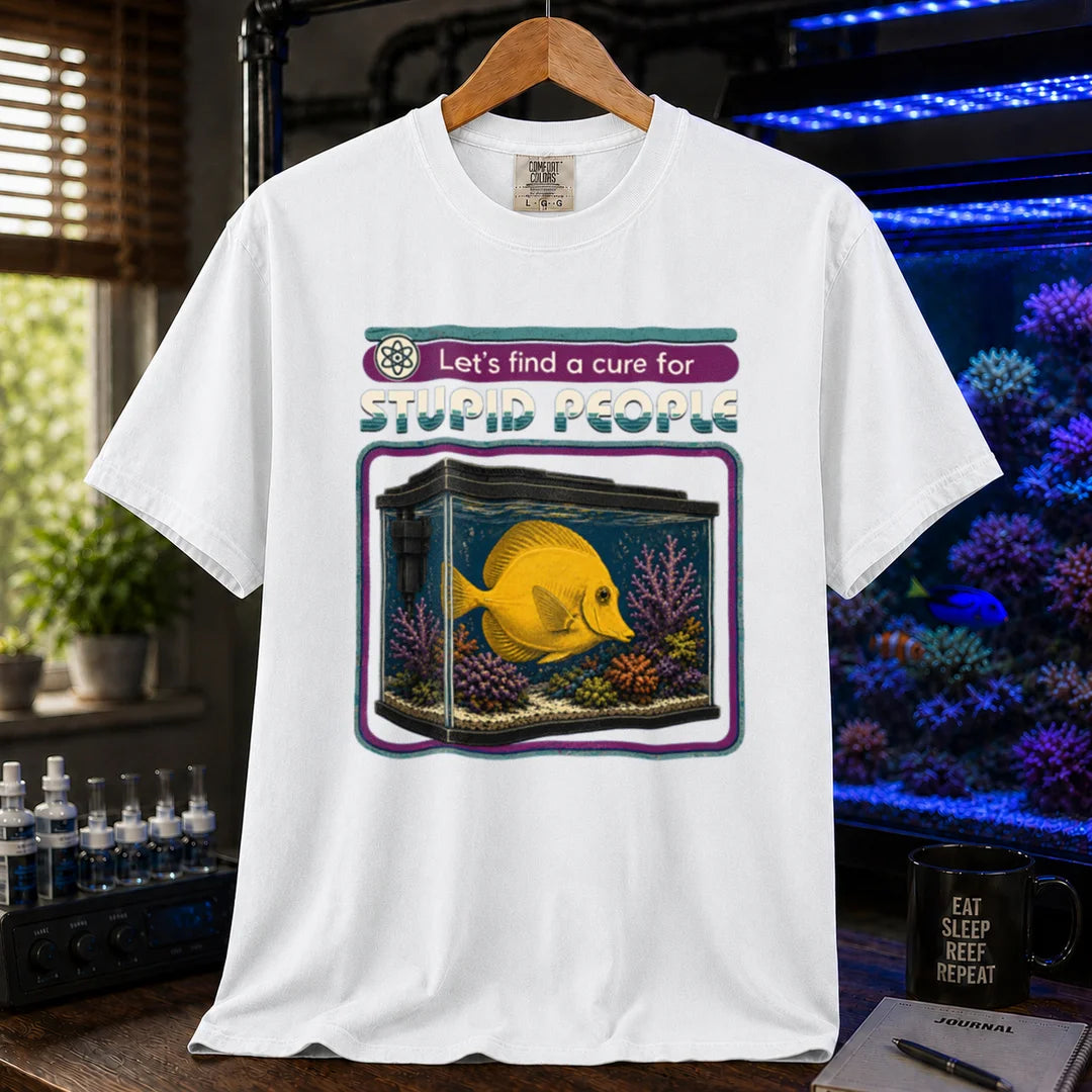 Saltwater aquarium graphic t-shirt featuring retro text reading Let's Find A Cure For Stupid People above an illustration of a yellow tang in a reef tank, white crew neck tee