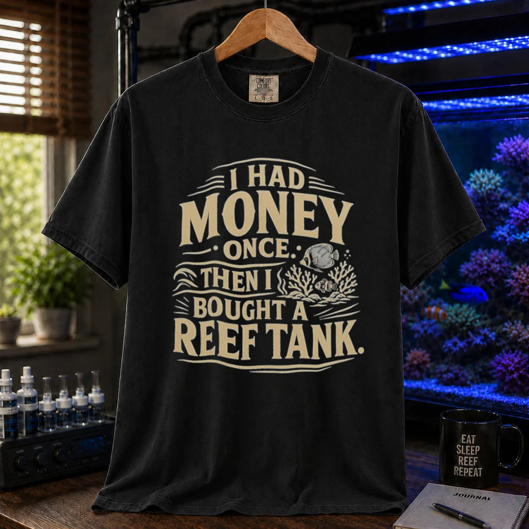 Saltwater aquarium graphic t-shirt featuring distressed cream typography reading I Had Money Once Then I Bought A Reef Tank with coral and fish illustrations, black crew neck tee