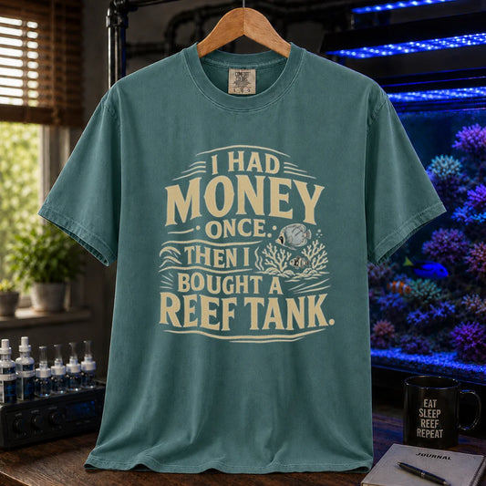 Saltwater aquarium graphic t-shirt featuring distressed cream typography reading I Had Money Once Then I Bought A Reef Tank with coral and fish illustrations, green crew neck tee
