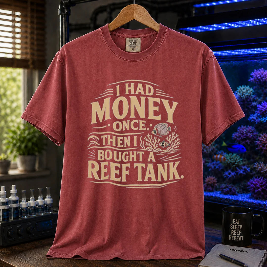 Saltwater aquarium graphic t-shirt featuring distressed cream typography reading I Had Money Once Then I Bought A Reef Tank with coral and fish illustrations, maroon, red crew neck tee