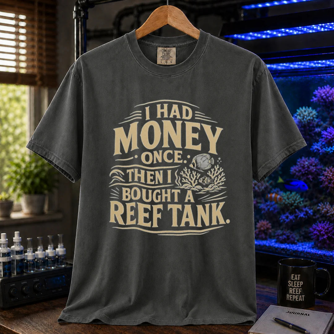 Saltwater aquarium graphic t-shirt featuring distressed cream typography reading I Had Money Once Then I Bought A Reef Tank with coral and fish illustrations, dark grey crew neck tee