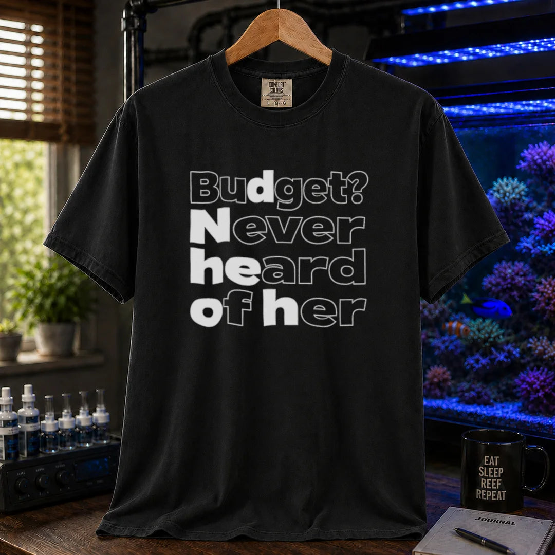 Saltwater aquarium graphic t-shirt featuring bold minimalist white typography reading Budget? Never Heard Of Her with outlined and solid letters, black crew neck tee
