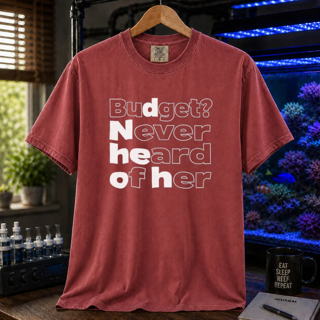 Saltwater aquarium graphic t-shirt featuring bold minimalist white typography reading Budget? Never Heard Of Her with outlined and solid letters, maroon, red crew neck tee