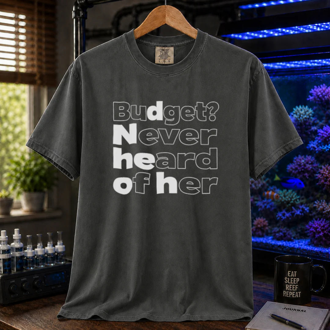 Saltwater aquarium graphic t-shirt featuring bold minimalist white typography reading Budget? Never Heard Of Her with outlined and solid letters, dark grey crew neck tee