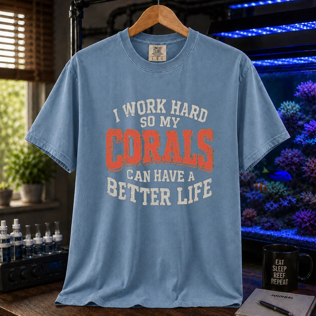 Saltwater aquarium graphic t-shirt featuring distressed cream and orange block typography reading I Work Hard So My Corals Can Have A Better Life, blue crew neck tee