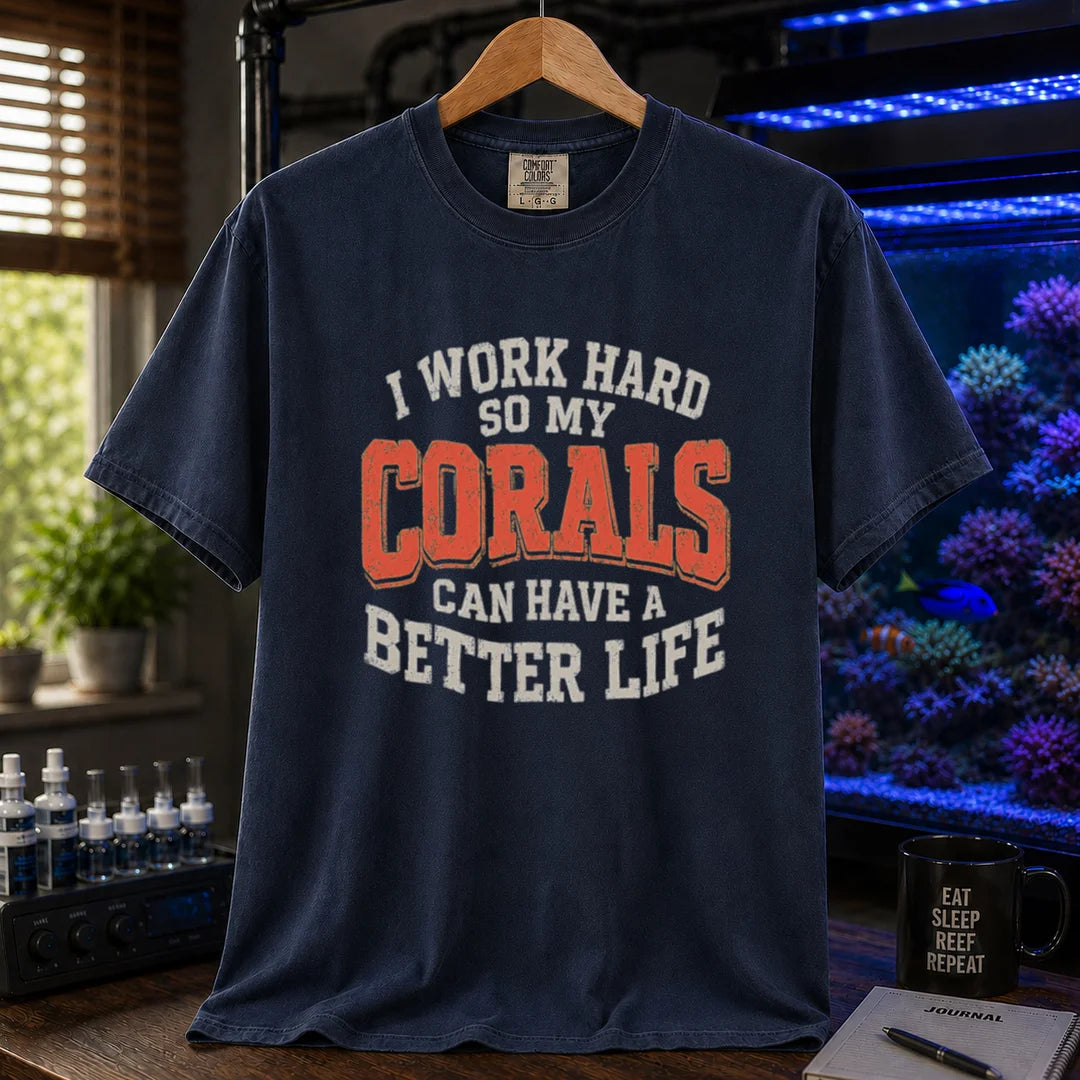 Saltwater aquarium graphic t-shirt featuring distressed cream and orange block typography reading I Work Hard So My Corals Can Have A Better Life, navy crew neck tee