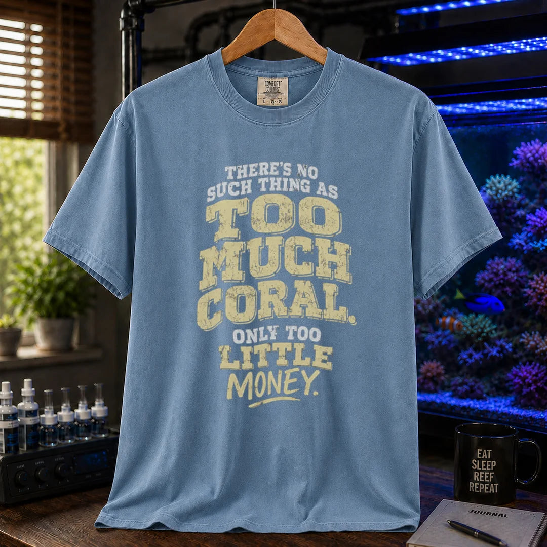 Saltwater aquarium graphic t-shirt featuring distressed cream and white typography reading There's No Such Thing As Too Much Coral. Only Too Little Money., blue crew neck tee