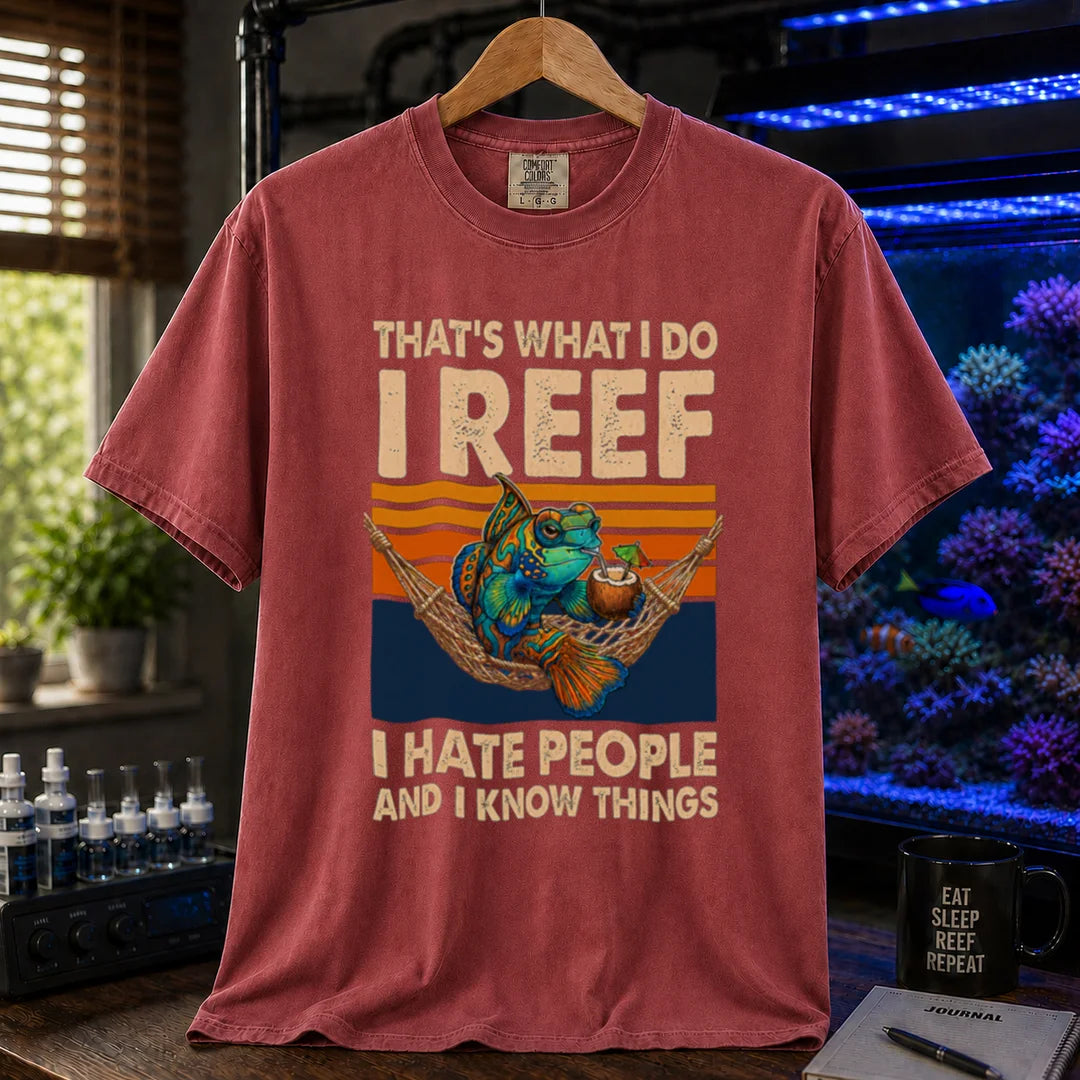 Saltwater aquarium graphic t-shirt featuring a mandarin goby in a hammock with a drink against a retro sunset and text reading That's What I Do I Reef I Hate People And I Know Things, maroon, red crew neck tee