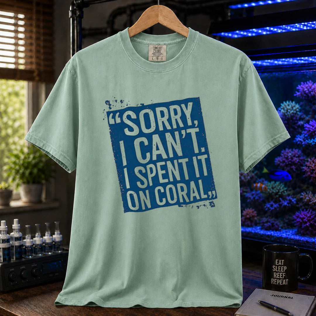 Saltwater aquarium graphic t-shirt featuring a distressed blue stamp graphic with white text reading Sorry, I Can't. I Spent It On Coral., green crew neck tee