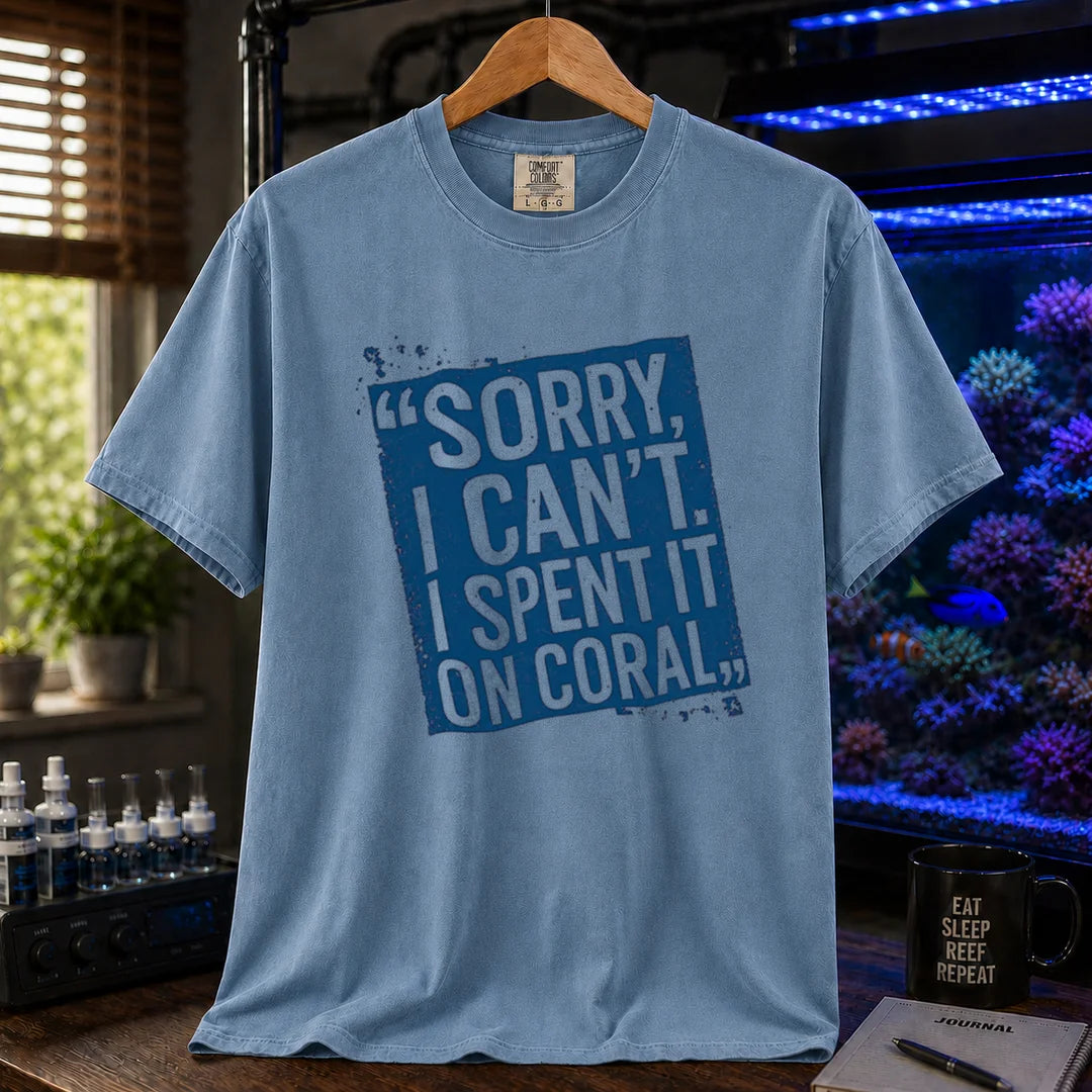 Saltwater aquarium graphic t-shirt featuring a distressed blue stamp graphic with white text reading Sorry, I Can't. I Spent It On Coral., blue crew neck tee