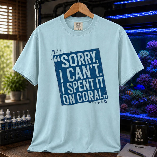 Saltwater aquarium graphic t-shirt featuring a distressed blue stamp graphic with white text reading Sorry, I Can't. I Spent It On Coral., light blue crew neck tee