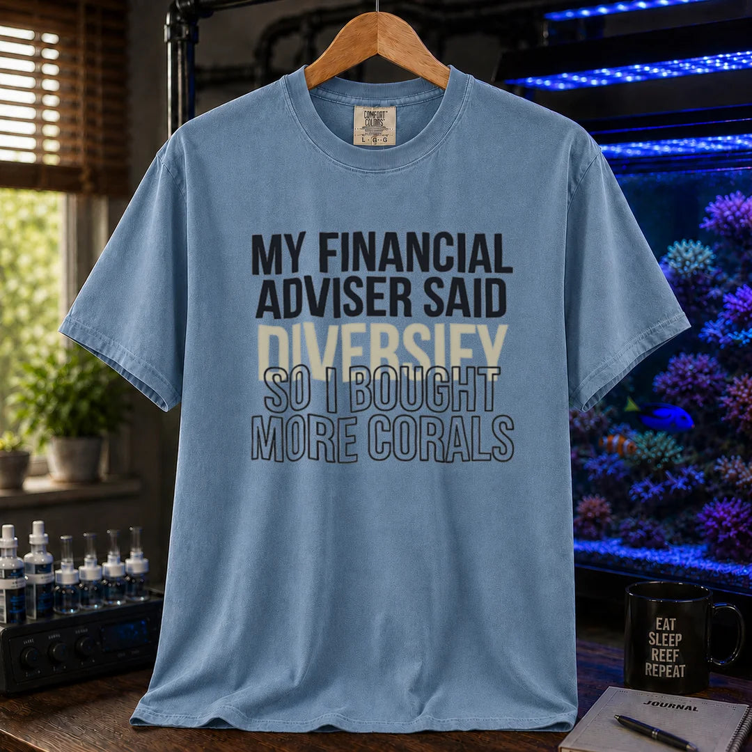 Saltwater aquarium graphic t-shirt featuring bold text reading My Financial Adviser Said Diversify So I Bought More Corals, blue crew neck te