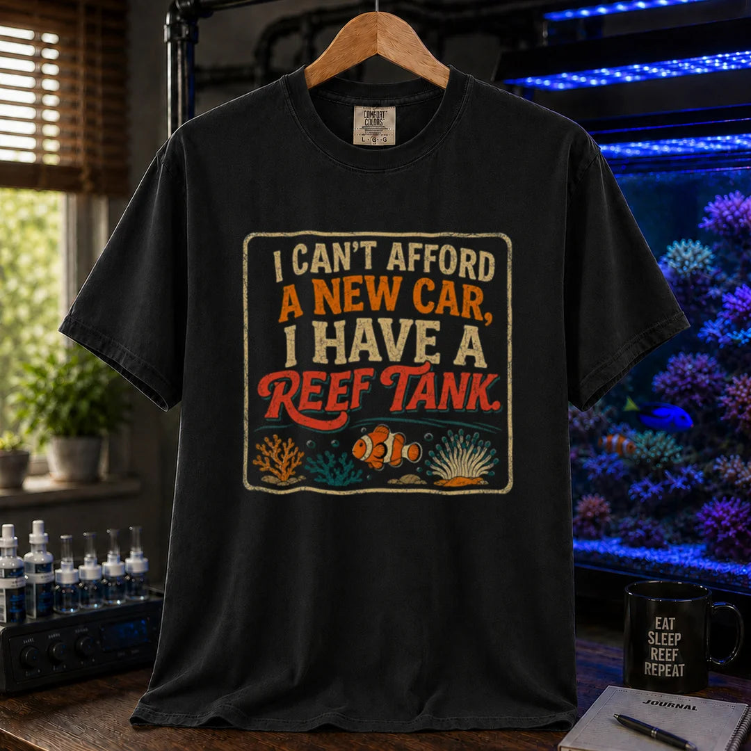 Saltwater aquarium graphic t-shirt featuring a vintage square design with text reading I Can't Afford a New Car, I Have a Reef Tank and a clownfish illustration, black crew neck tee