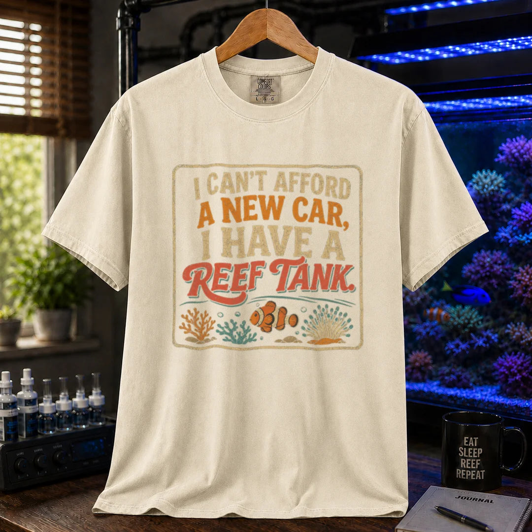 Saltwater aquarium graphic t-shirt featuring a vintage square design with text reading I Can't Afford a New Car, I Have a Reef Tank and a clownfish illustration, cream, beige, ivory crew neck tee