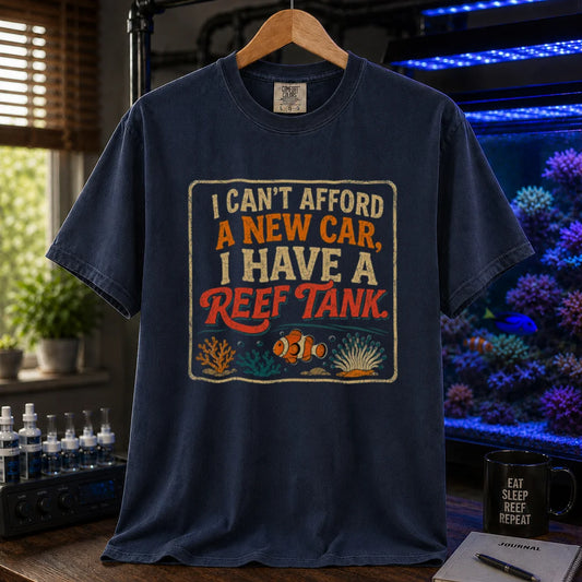 Saltwater aquarium graphic t-shirt featuring a vintage square design with text reading I Can't Afford a New Car, I Have a Reef Tank and a clownfish illustration, navy crew neck tee
