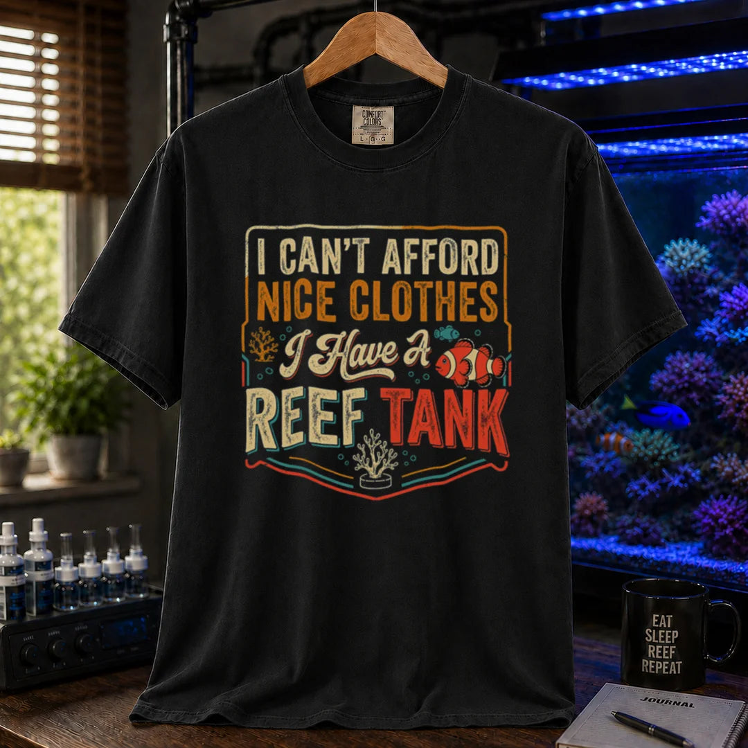 Saltwater aquarium graphic t-shirt featuring a vintage square design with text reading I Can't Afford Nice Clothes, I Have a Reef Tank and a clownfish illustration, black crew neck tee