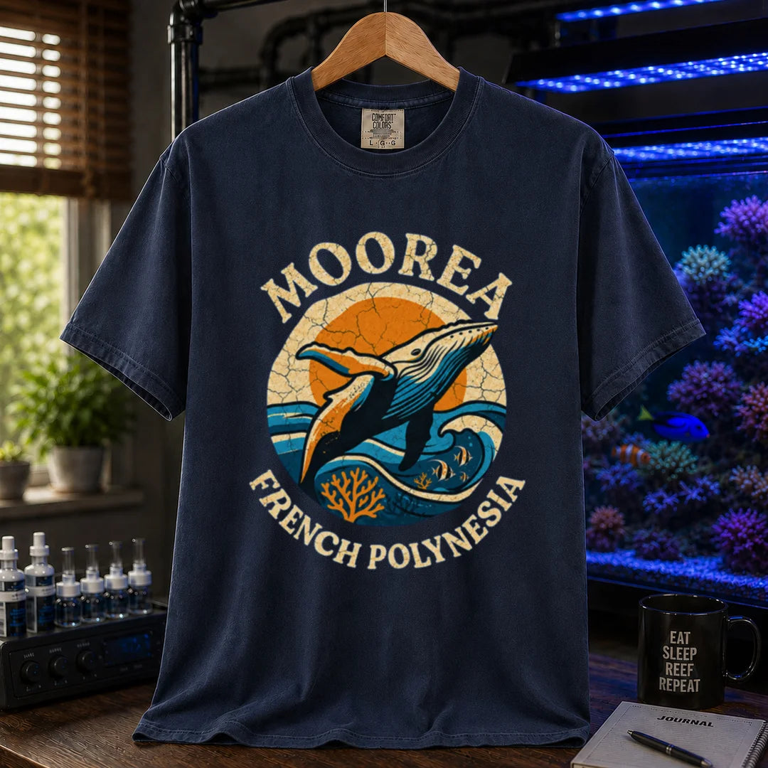 Saltwater aquarium graphic t-shirt featuring a retro circular emblem with a breaching whale and coral, arched text reading Moorea French Polynesia, navy crew neck tee