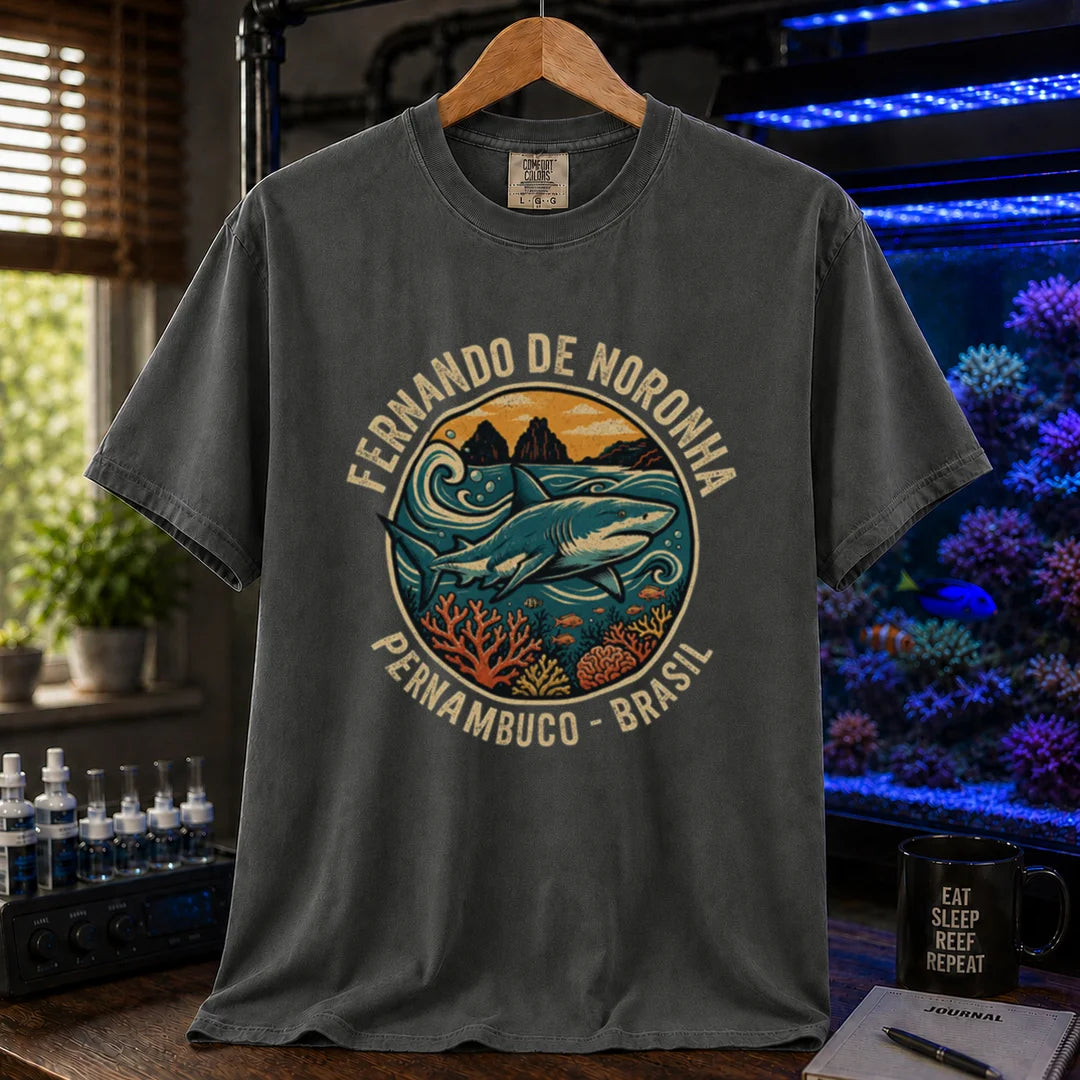 Saltwater aquarium graphic t-shirt featuring a retro circular emblem with a shark and coral, arched text reading Fernando de Noronha Pernambuco Brasil, dark grey crew neck tee