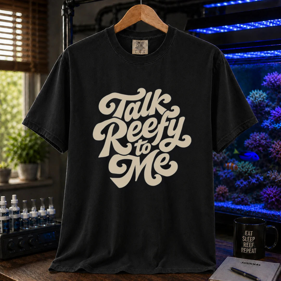 Saltwater aquarium graphic t-shirt featuring smooth retro cream script typography reading Talk Reefy to Me, black crew neck tee
