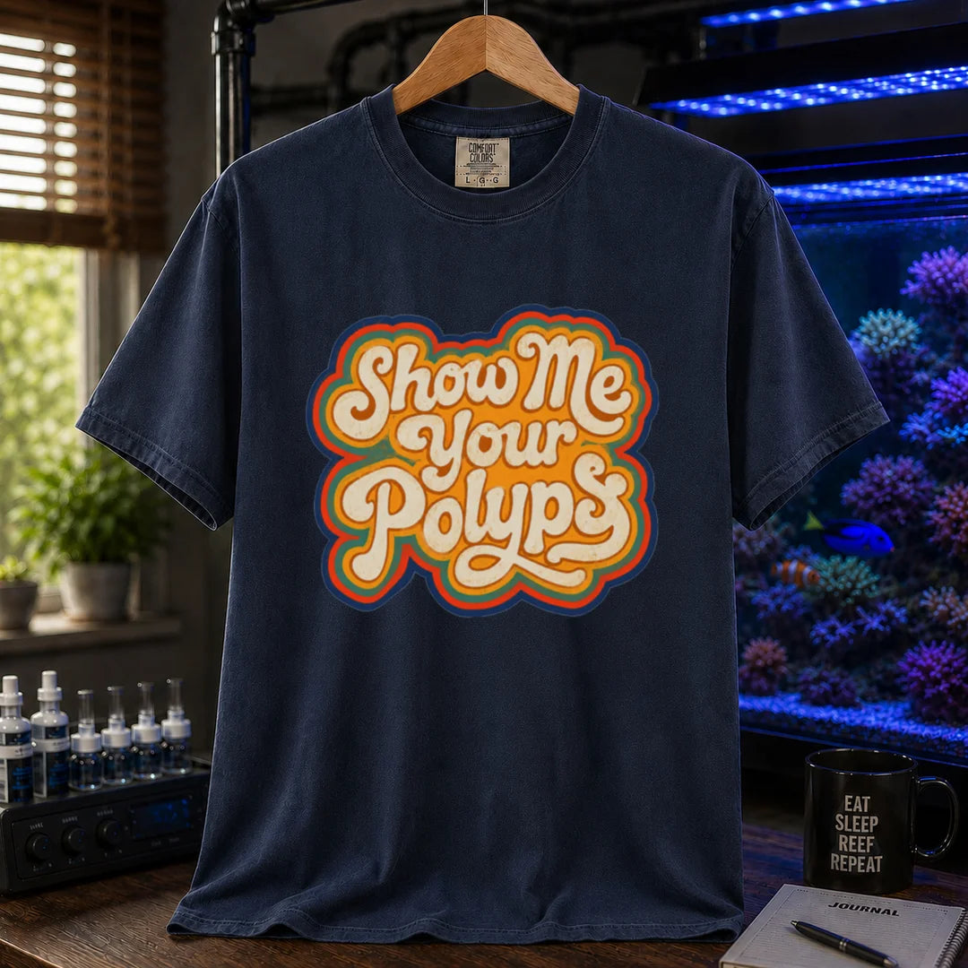 Saltwater aquarium graphic t-shirt featuring retro multi-layered stacked typography in cream, yellow, and orange reading Show Me Your Polyps, navy crew neck tee