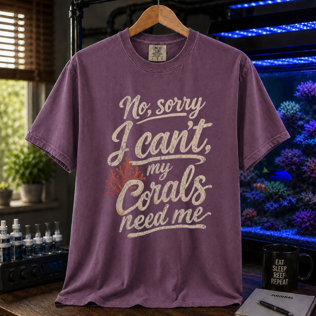 Saltwater aquarium graphic t-shirt featuring distressed cream script typography and a red coral graphic reading No, sorry I can't, my corals need me, purple crew neck tee