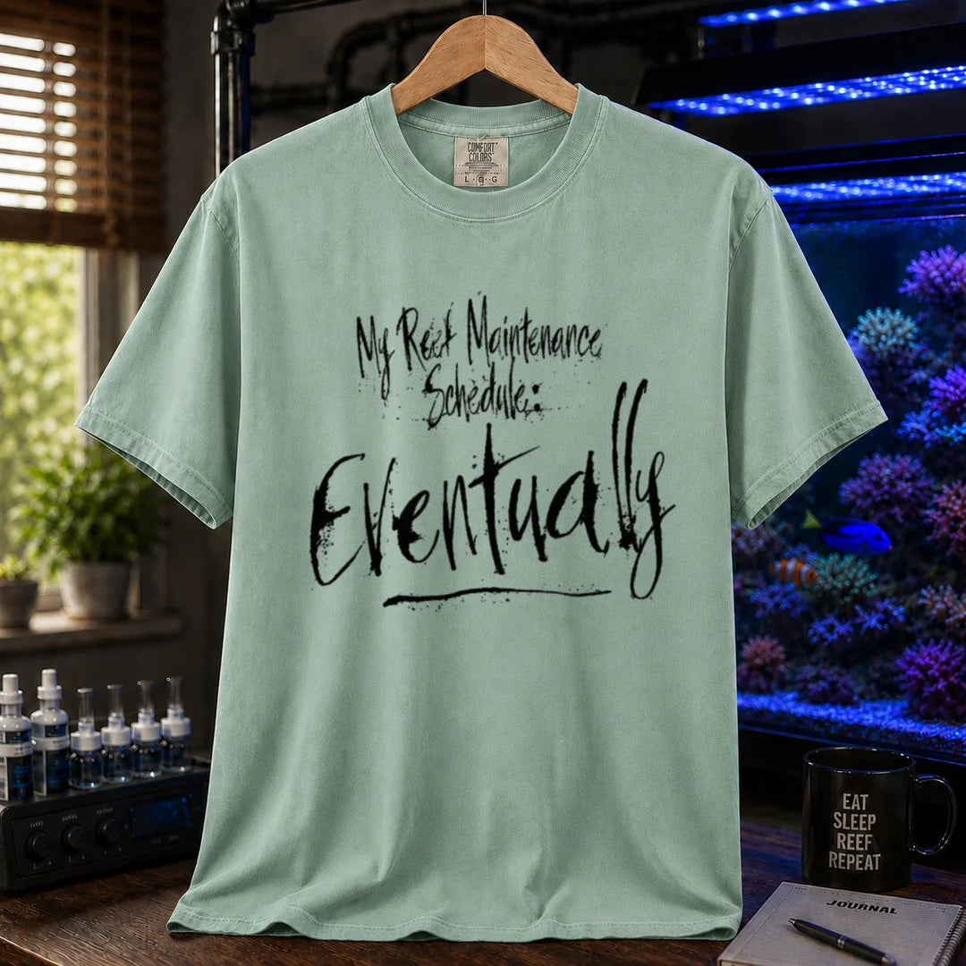 Saltwater aquarium graphic t-shirt featuring grunge brushstroke typography reading My Reef Maintenance Schedule: Eventually, green crew neck tee