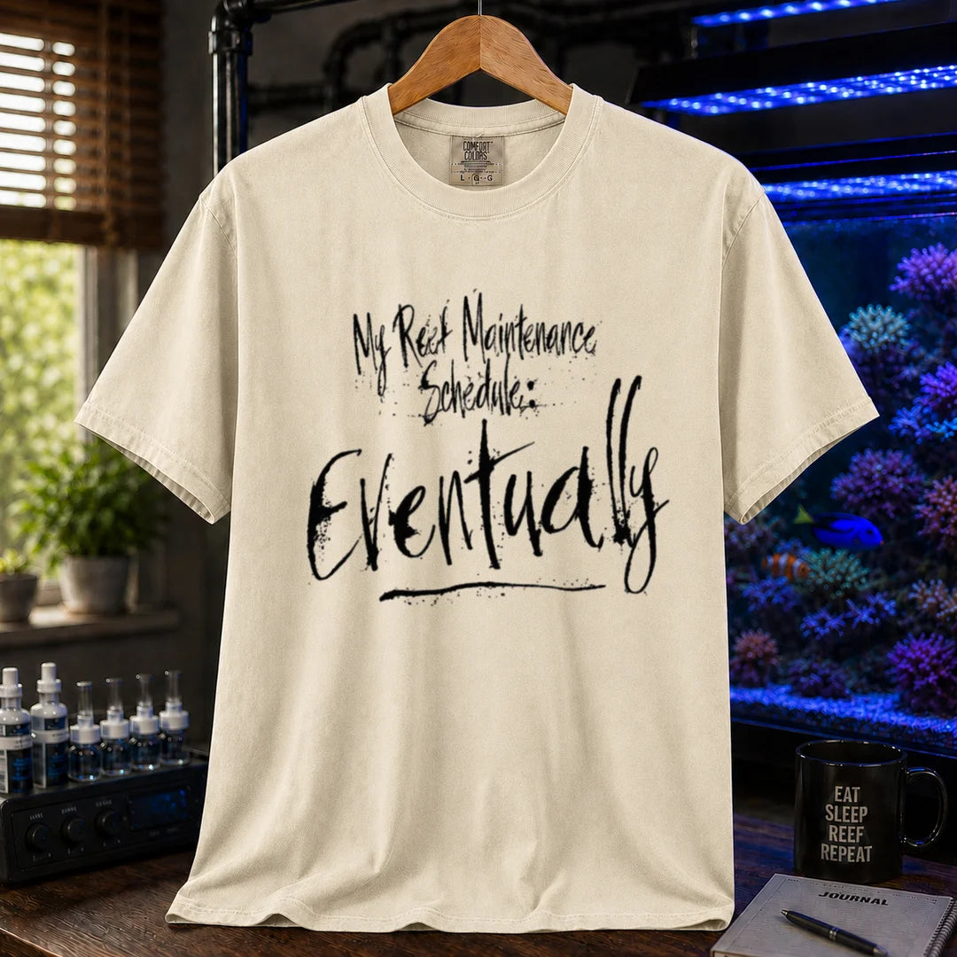 Saltwater aquarium graphic t-shirt featuring grunge brushstroke typography reading My Reef Maintenance Schedule: Eventually, cream, beige, ivory crew neck tee