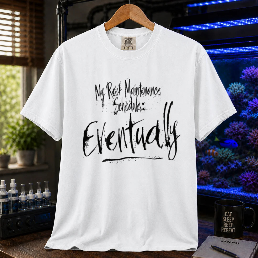 Saltwater aquarium graphic t-shirt featuring grunge brushstroke typography reading My Reef Maintenance Schedule: Eventually, white crew neck tee