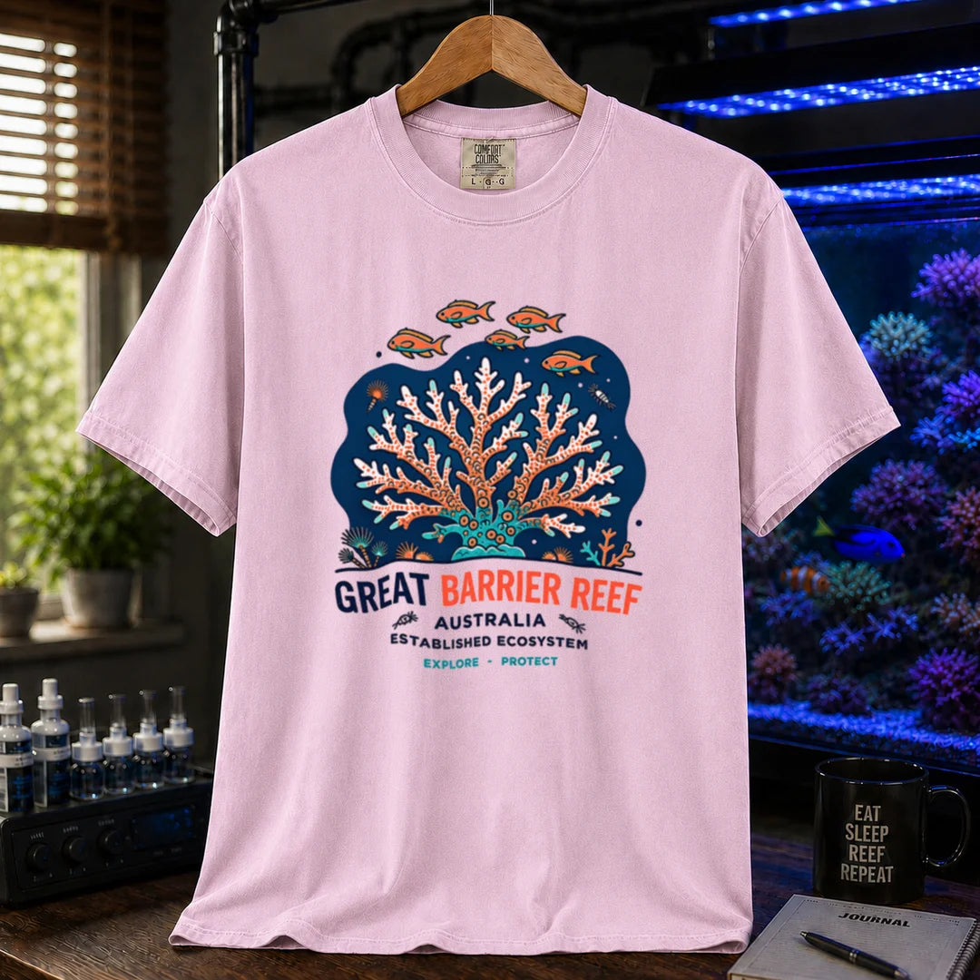 Saltwater aquarium graphic t-shirt featuring an illustration of a coral colony and fish with text reading Great Barrier Reef Australia Established Ecosystem Explore Protect, pink crew neck tee