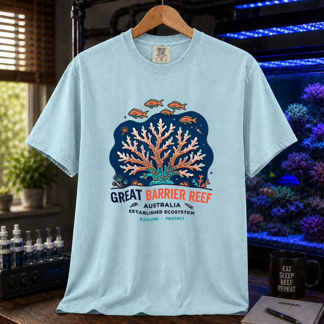 Saltwater aquarium graphic t-shirt featuring an illustration of a coral colony and fish with text reading Great Barrier Reef Australia Established Ecosystem Explore Protect, light blue crew neck tee
