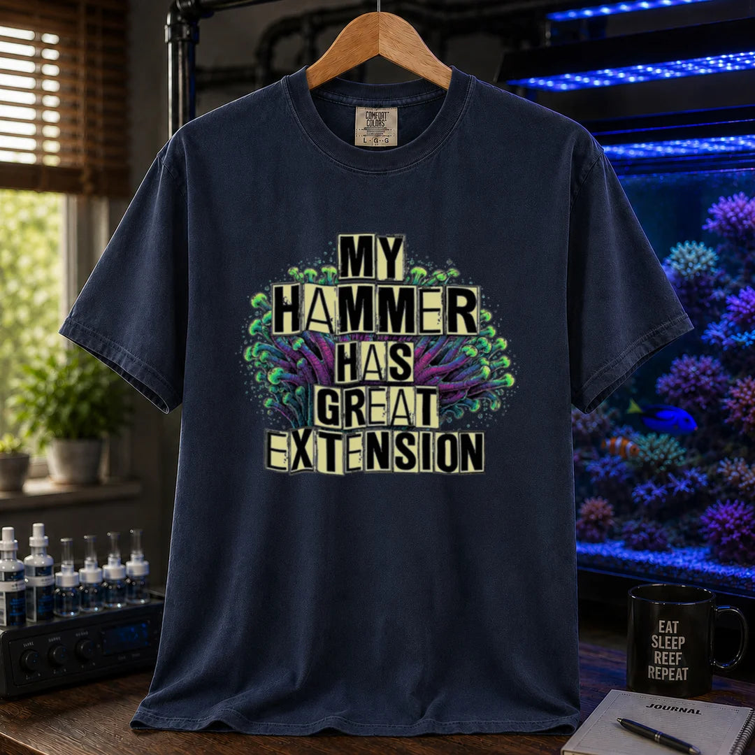 Saltwater aquarium graphic t-shirt featuring bold block text reading My Hammer Has Great Extension layered over a hammer coral illustration, navy crew neck tee