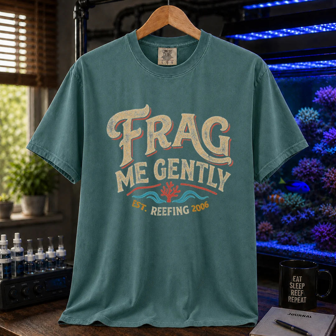 Saltwater aquarium graphic t-shirt featuring distressed vintage cream typography reading Frag Me Gently with coral graphics and Est. Reefing 2006, green crew neck tee